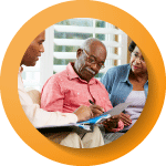 circle img with 3 people looking at some documents